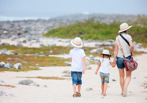 Family walking on Galapagos beach