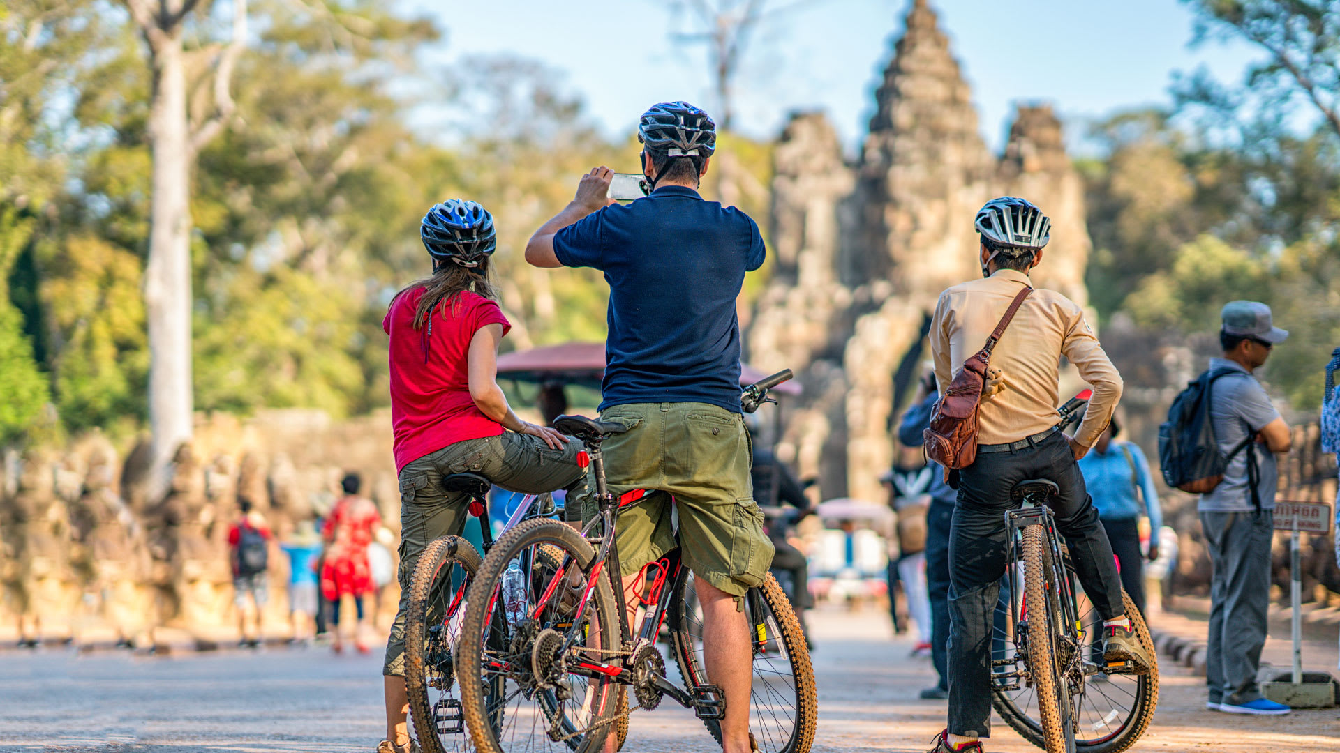 tourists biking in angkor wat